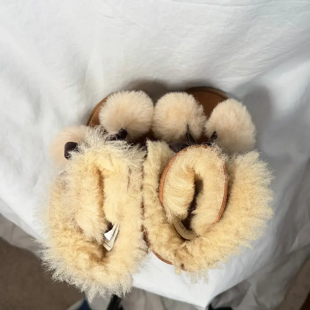 UGG Toddler Gita chestnut boots.  Front bow pom-poms.  Size 8T. Worn once
